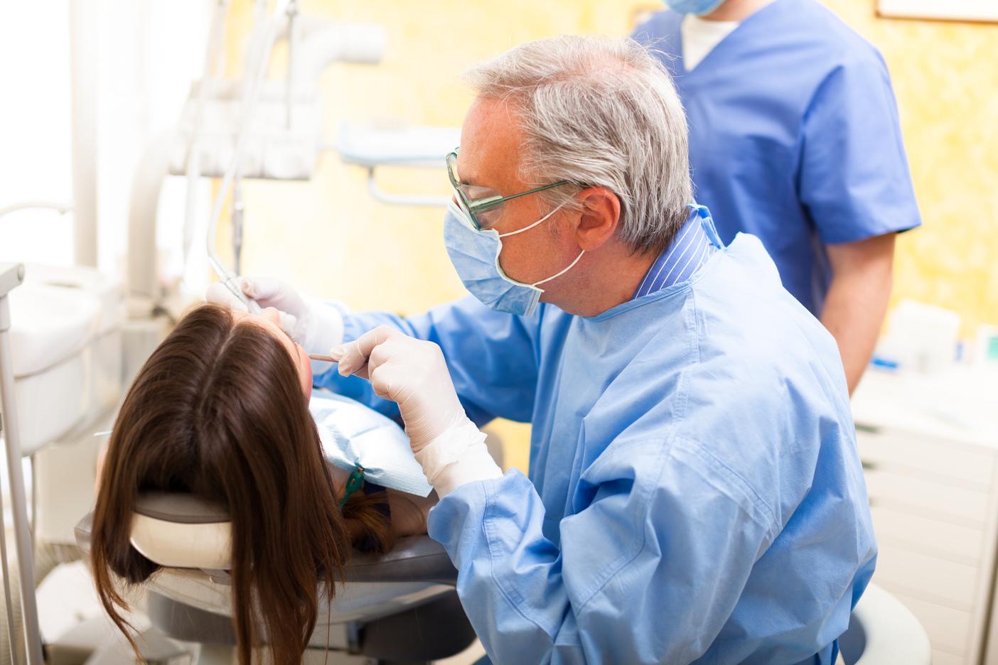 Dentist in Webster Groves MO performing a dental exam