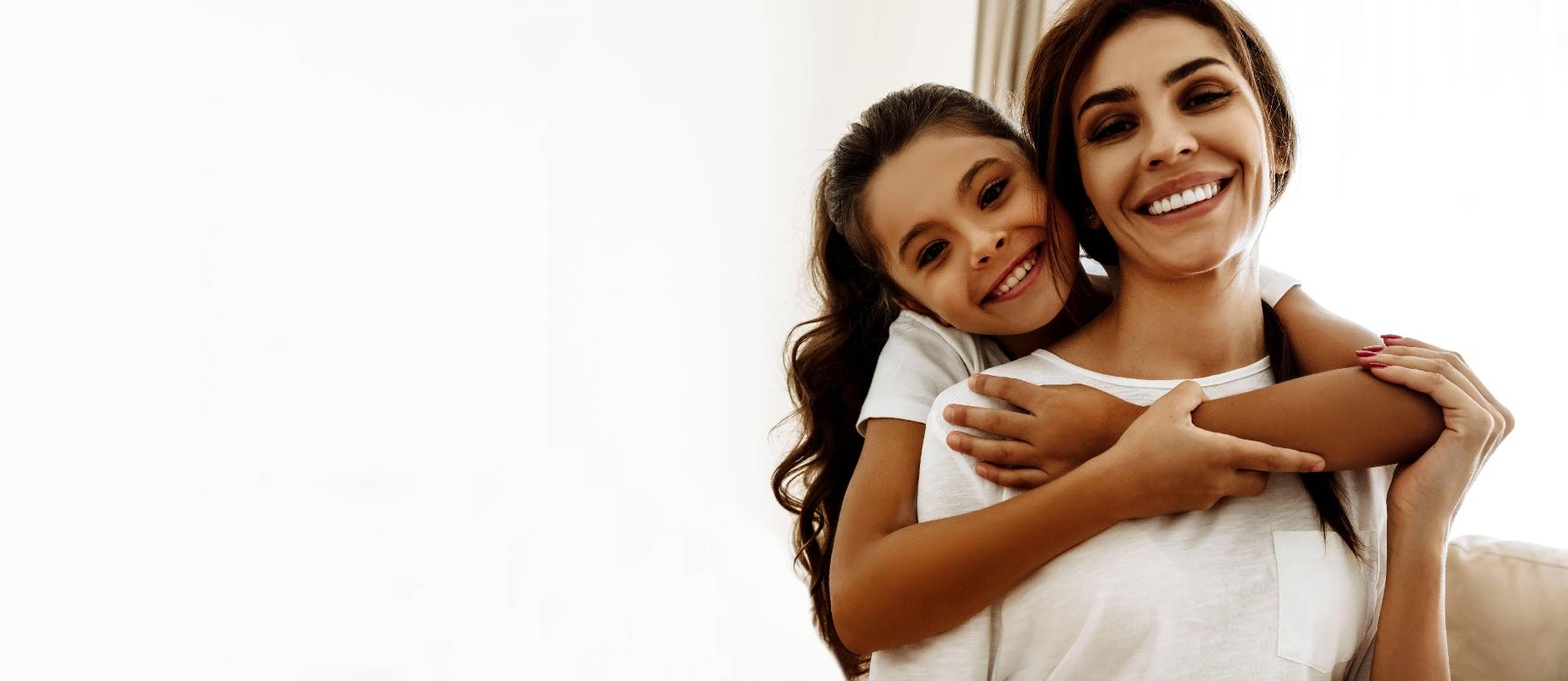 Mother and daughter smiling at dental office in Webster Groves