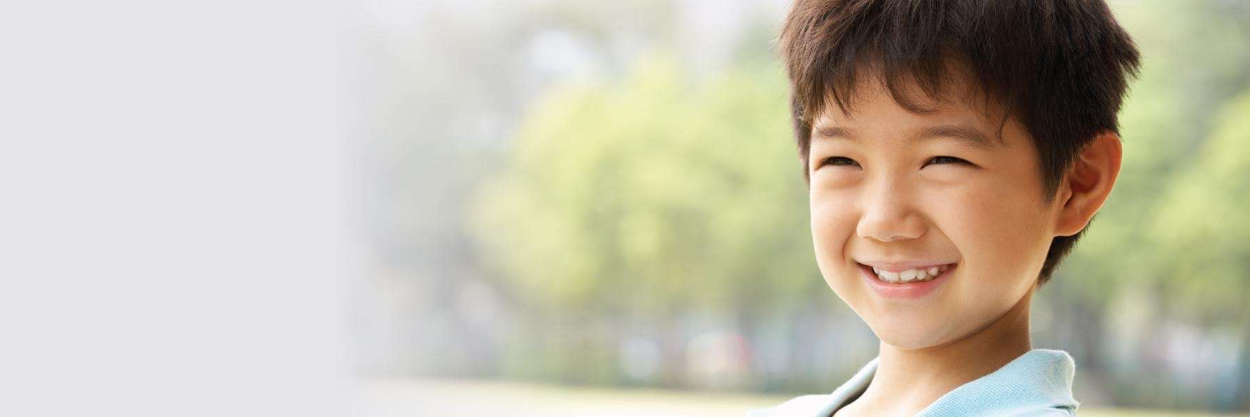 Child smiling at Blackburn Park in Webster Groves, MO