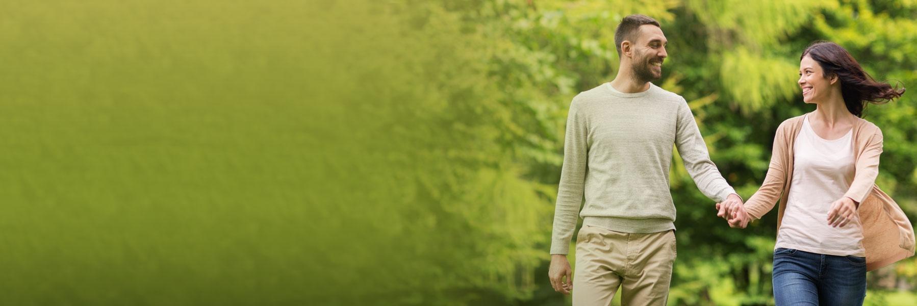 Couple holding hands at Deer Creek Park in Webster Groves MO