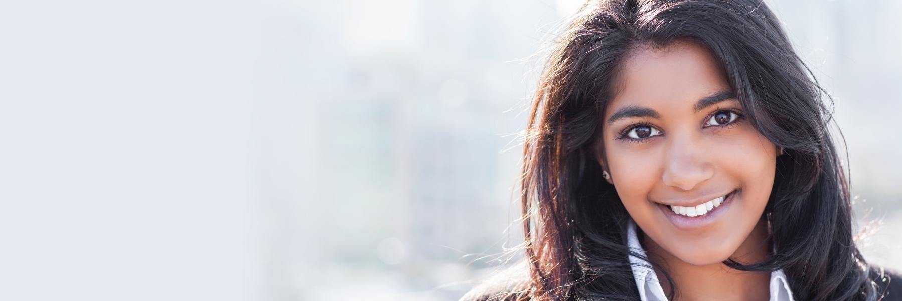 Woman smiling at dentist office in Webster Groves MO